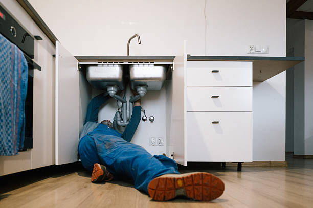 Professional Plumbing technician working in Breckenridge, MI